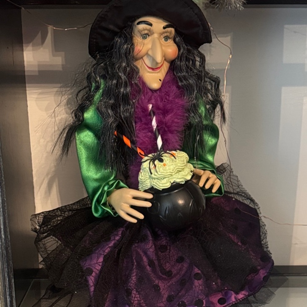 Whimsical Witch Figurine with Green and Purple Accents